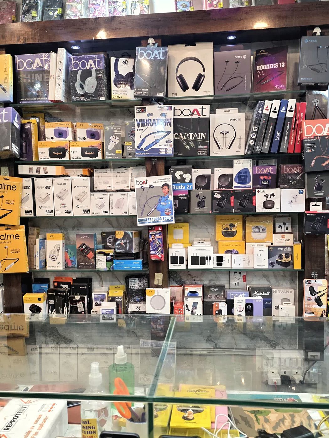 Shelves of accessories and phones in the glass counter