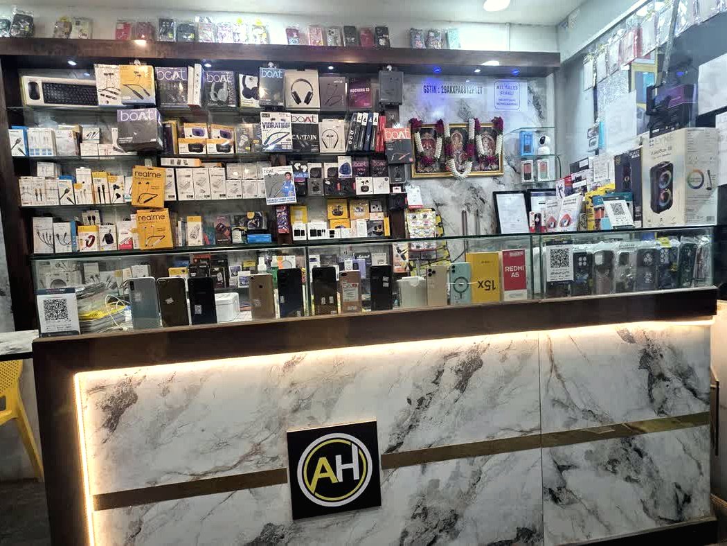 Service counter with AH logo and phones on display